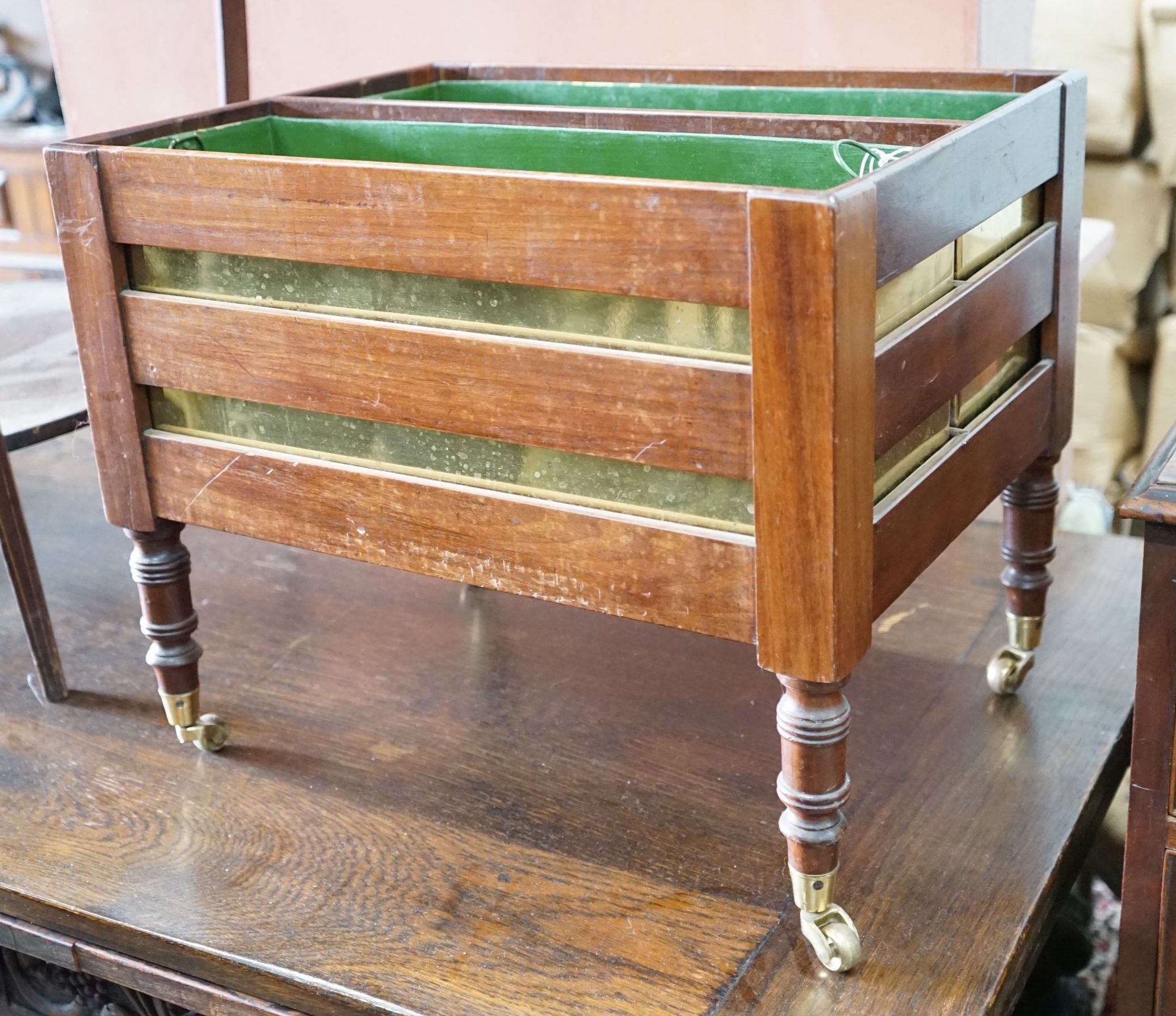 A 19th century mahogany two division planter with brass liners converted from a Canterbury, width 50cm, depth 38cm, height 42cm